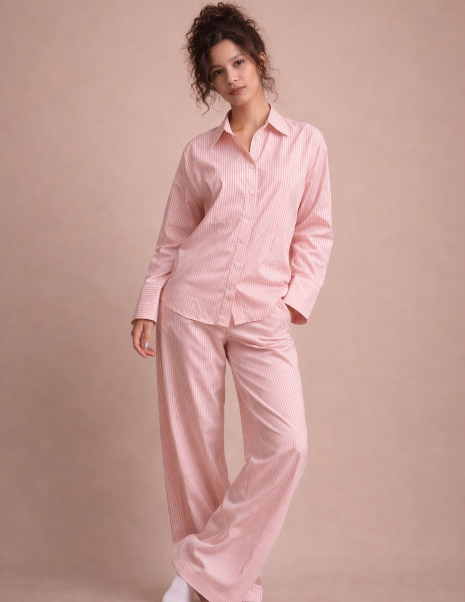 Rosie Set sewing pattern shown as a pink striped pajama set with button-up shirt and wide-leg pants
