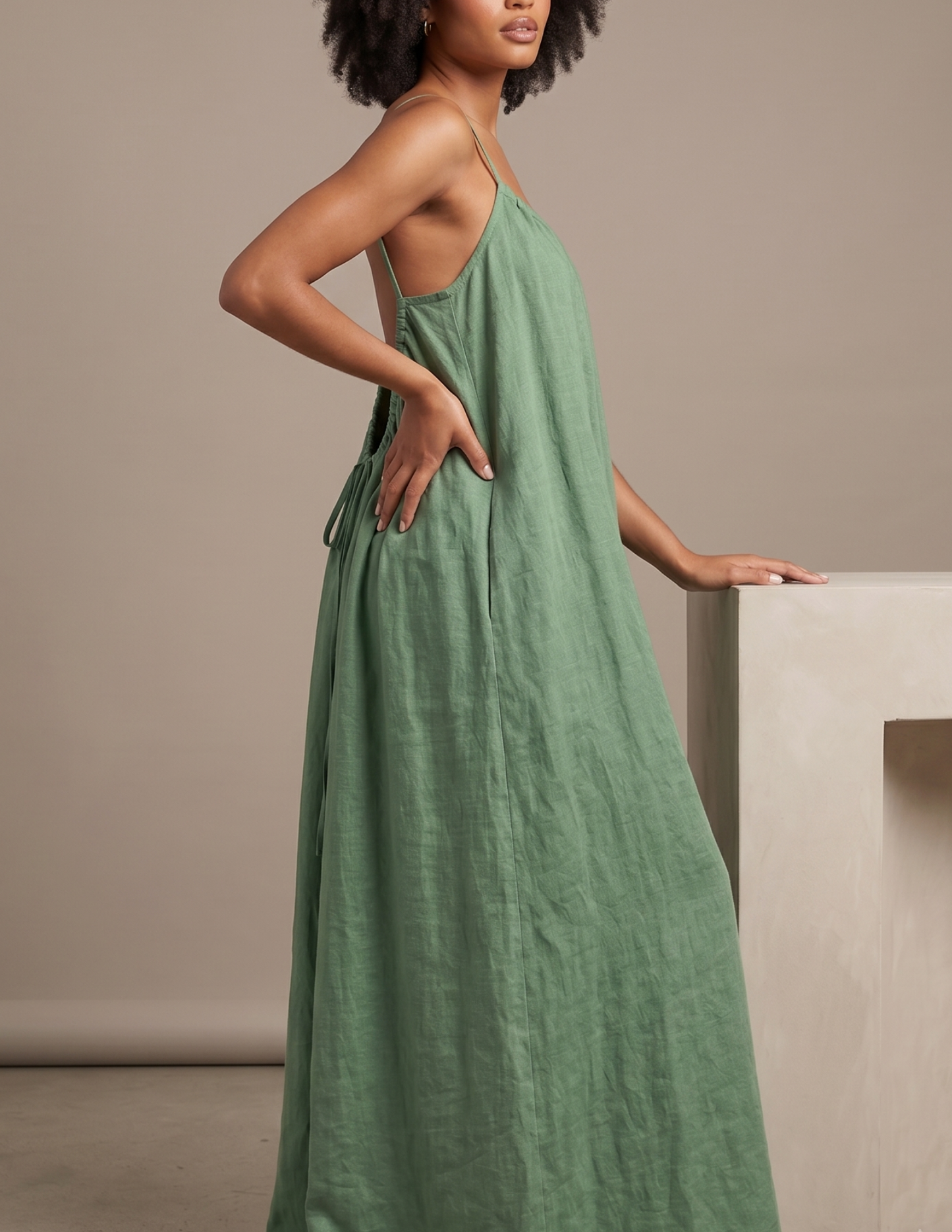 Side view of the 
Amazonie summer 
 maxi dress showing 
the loose fit, flowing 
skirt and lightweight 
linen style.