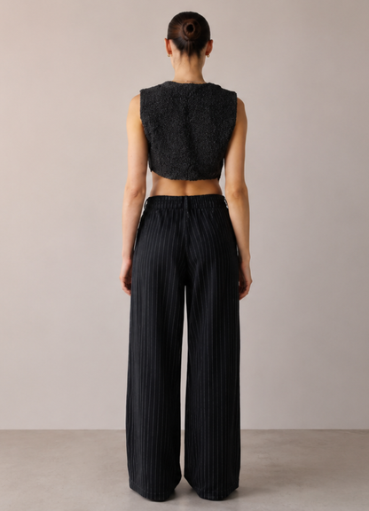 Back view of the Women's Cropped 
Vest Sewing Pattern PDF highlighting the cropped waist-length back and clean tailored finish