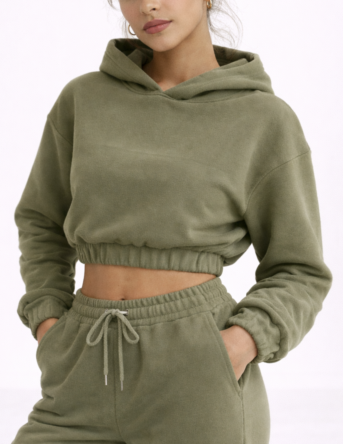 Close-up of the EBONY cropped hoodie showing the hood, dropped shoulders, elastic waistband and relaxed fit.