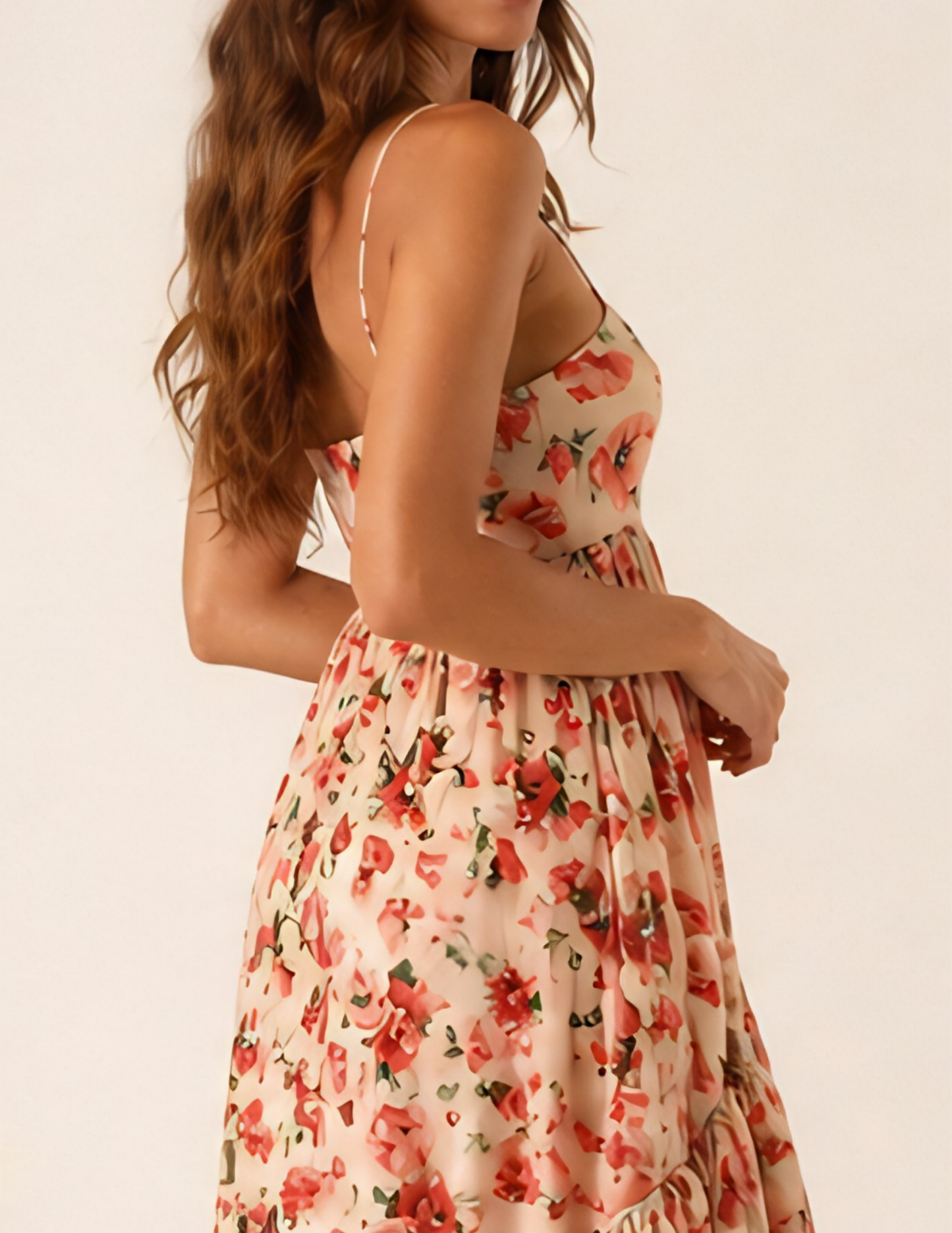 Woman wearing a floral dress with a plain background