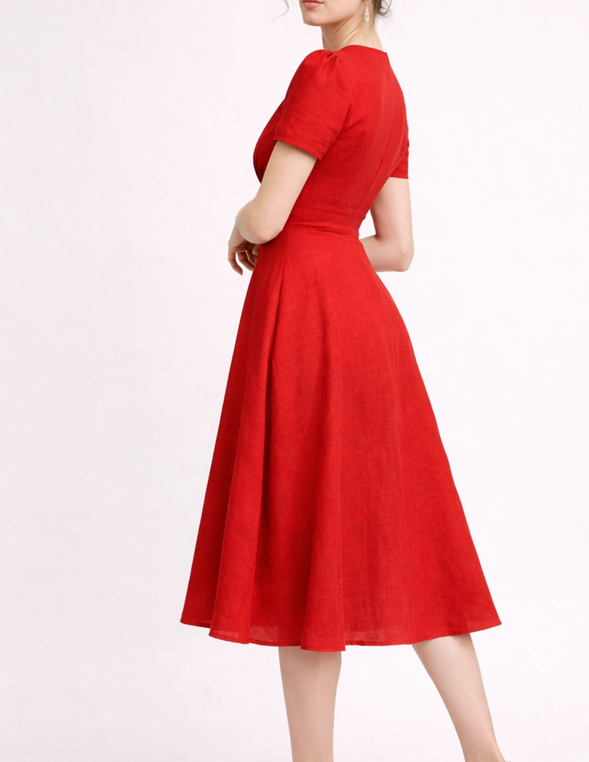 FAYA dress sewing pattern side view in red linen, showing the fitted bodice, defined waist and elegant flared midi skirt.