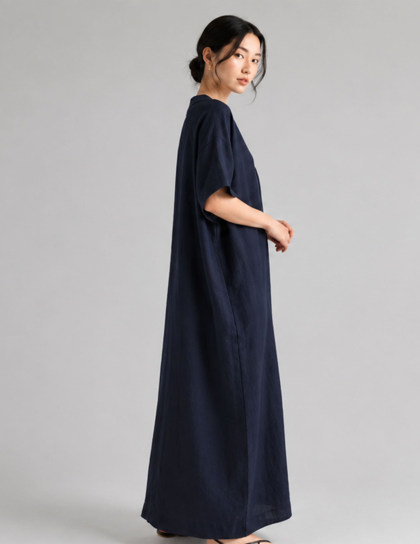 Women's V-neck dress sewing pattern 
PDF shown in a loose fit with short 
sleeves and long flowing silhouette